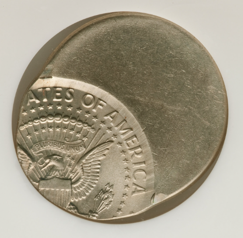 1996 Kennedy half dollar off-center strike with design shifted and blank crescent on the opposite rim