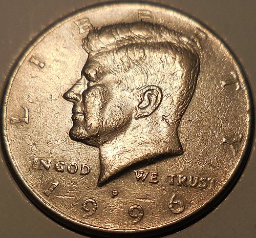 1996 Kennedy half dollar die crack and cud error showing raised metal lines from a fractured working die